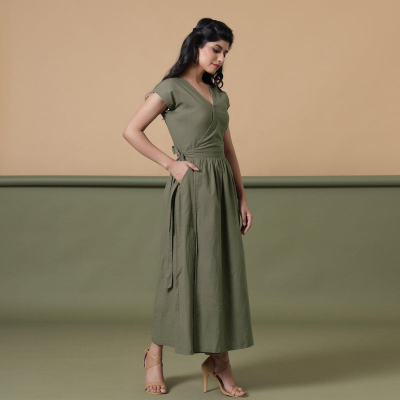 Right View of a Model wearing Reversible Shibori Green Wrap Dress