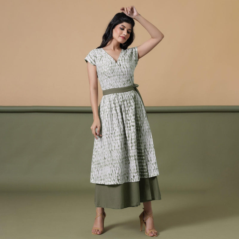 Front View of a Model wearing Reversible Shibori Green Wrap Dress