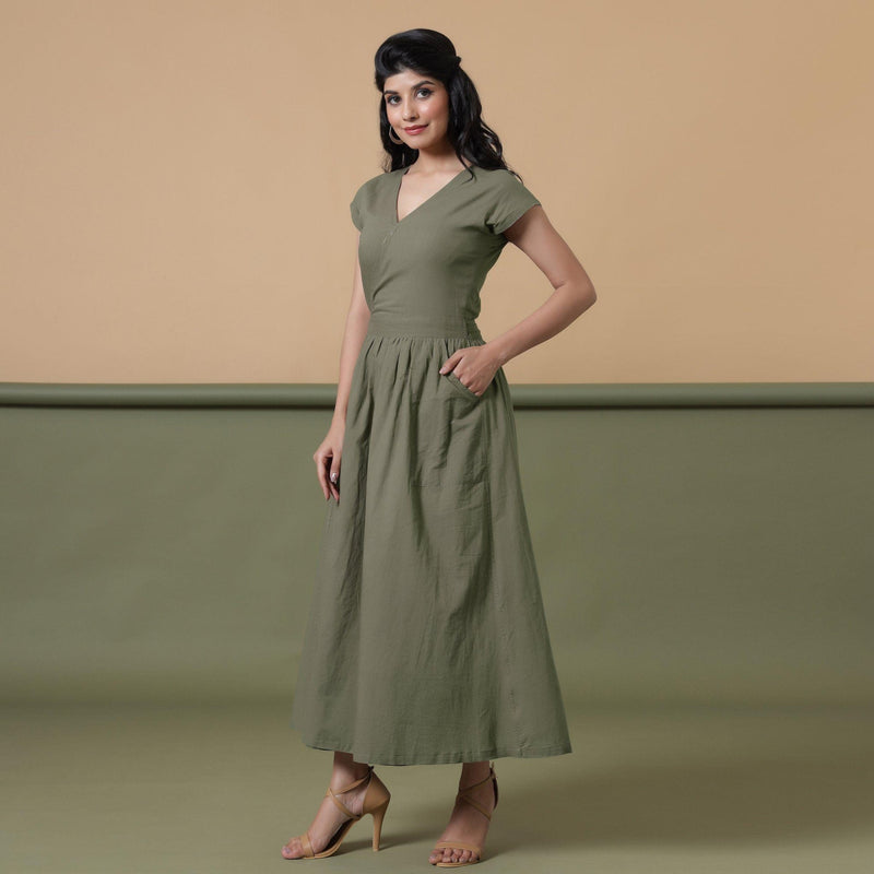 Left View of a Model wearing Reversible Shibori Green Wrap Dress