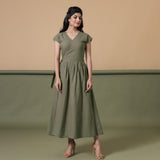 Front View of a Model wearing Reversible Shibori Green Wrap Dress