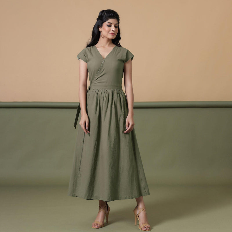 Front View of a Model wearing Reversible Shibori Green Wrap Dress