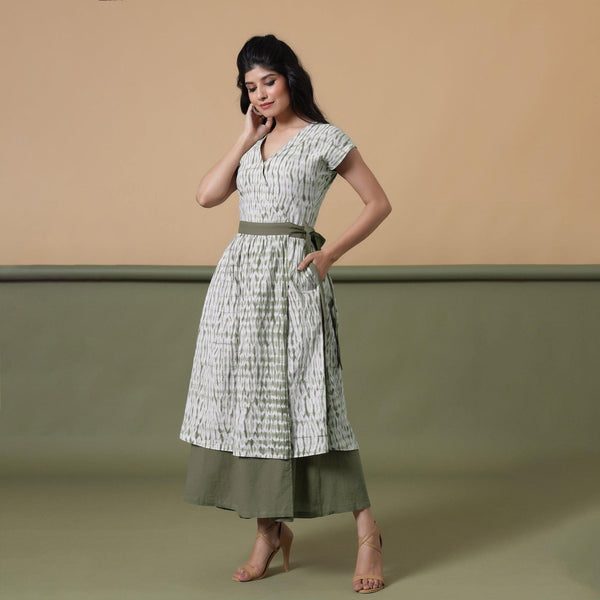 Front View of a Model wearing Reversible Shibori Green Wrap Dress