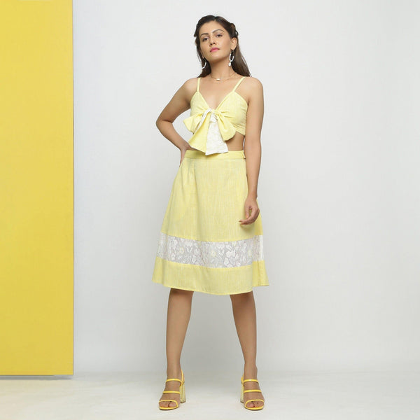 Front View of a Model wearing Lacy Yellow Tube Top and A-Line Skirt Set