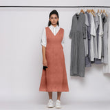 Front View of a Model wearing Rust 100% Linen V-Neck Midi Pinafore Dress