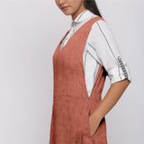 Left Detail of a Model wearing Rust 100% Linen V-Neck Midi Pinafore Dress