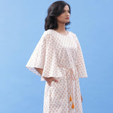 Right View of a Model wearing Hand Block Printed Rust Lotus Kaftan Dress