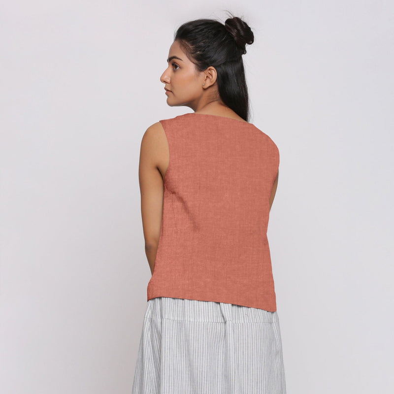 Back View of a Model wearing Rust Sandstone Linen Split Neck Button-Down Sleeveless Top