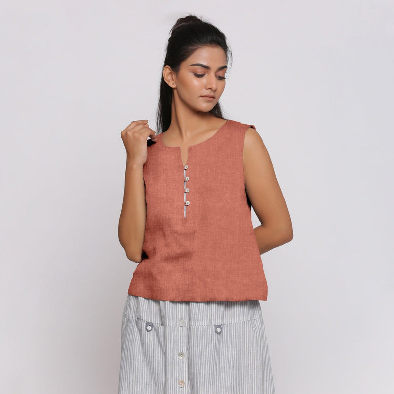 Front View of a Model wearing Rust Sandstone Linen Split Neck Button-Down Sleeveless Top