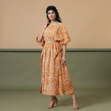 Left View of a Model wearing Rust Sandstone Shibori Kaftan Dress