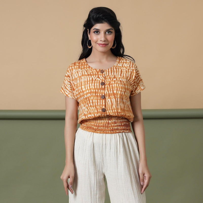 Front View of a Model wearing Shibori Button-Down Blouson Top