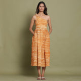 Front View of a Model wearing Rust Shibori One-Shoulder Midi Dress