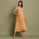 Right View of a Model wearing Rust Shibori One-Shoulder Midi Dress