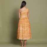 Back View of a Model wearing Rust Shibori One-Shoulder Midi Dress