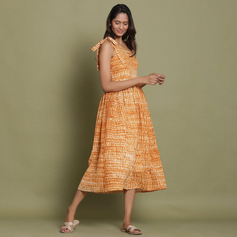 Right View of a Model wearing Rust Shibori One-Shoulder Midi Dress