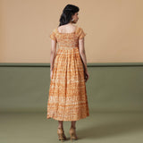 Back View of a Model wearing Rust Shibori Elasticated Gathered Dress