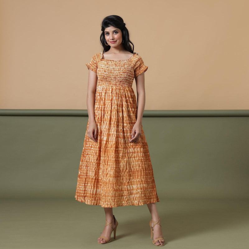 Front View of a Model wearing Rust Shibori Elasticated Gathered Dress