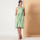 Front View of a Model wearing Cotton Sage Green Gathered Yoke Dress