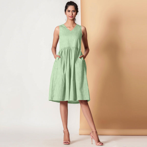 Front View of a Model wearing Cotton Sage Green Gathered Yoke Dress