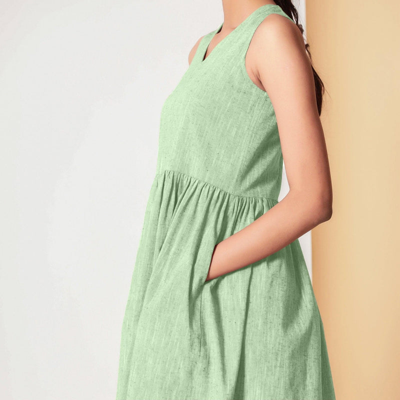 Left Detail of a Model wearing Cotton Sage Green Gathered Yoke Dress