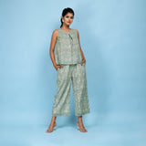 Front View of a Model wearing Sage Green Pleated Top and Culottes Set