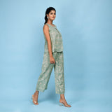 Right View of a Model wearing Sage Green Pleated Top and Culottes Set