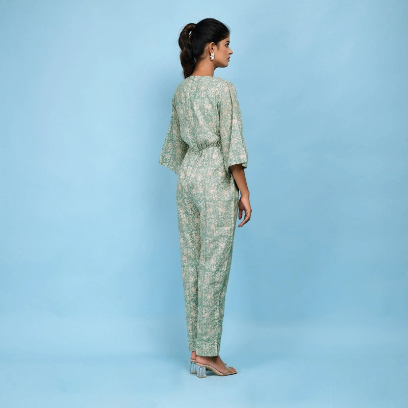 Back View of a Model wearing Sage Green Block Printed Ankle Length Cotton Jumpsuit