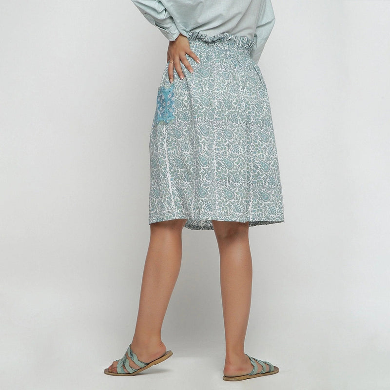 Left View of a Model wearing Sage Green Block Printed Cotton Knee Length Skirt