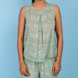 Front Detail of a Model wearing Sage Green Block Printed 100% Cotton Pleated Top