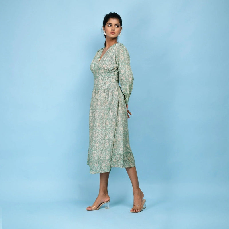 Left View of a Model wearing Sage Green Cotton Block Printed Blouson Dress