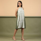 Right View of a Model wearing Moss Green Shibori Halter Neck A-Line Dress