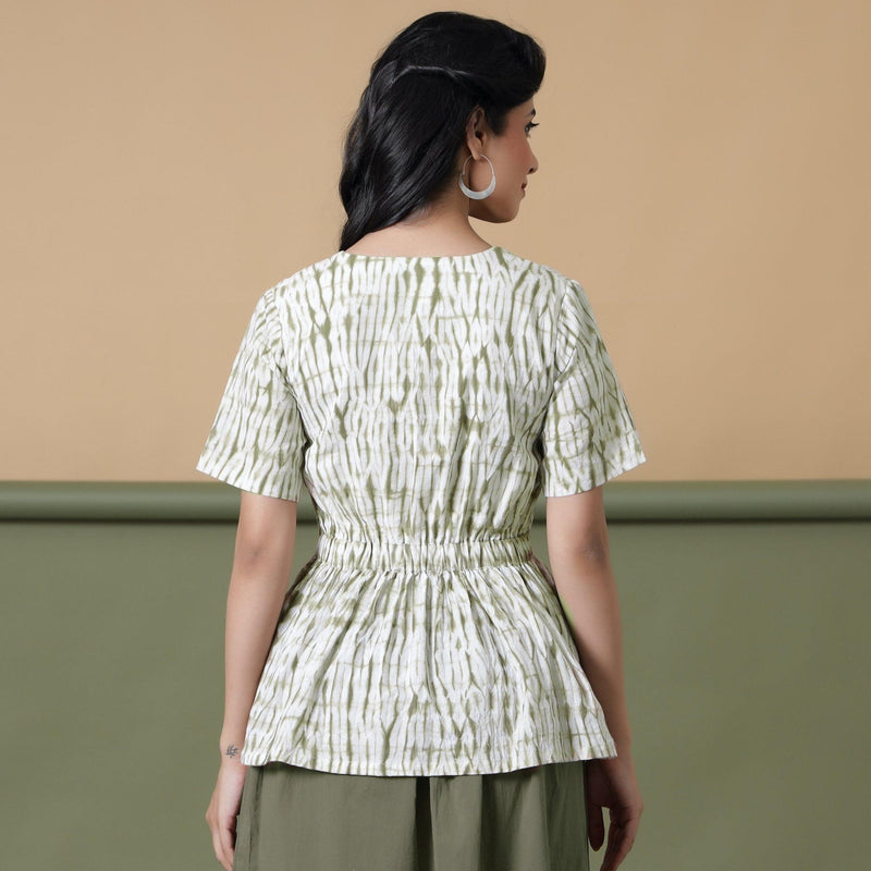 Back View of a Model wearing Moss Green Shibori Peplum Top