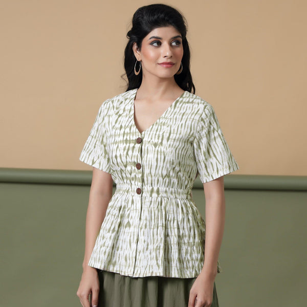 Front View of a Model wearing Moss Green Shibori Peplum Top