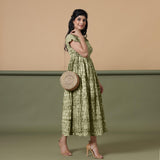 Right View of a Model wearing Light Green Shibori Elasticated Gathered Dress