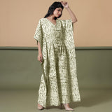 Right View of a Model wearing Light Green Shibori V-Neck Cotton Kaftan Jumpsuit