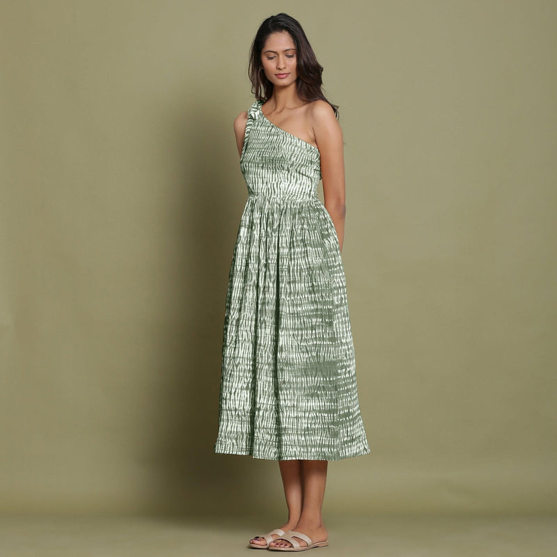 Left View of a Model wearing Light Green Shibori One-Shoulder Midi Dress