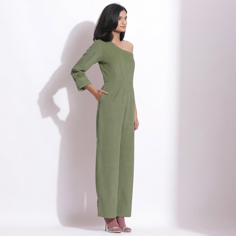 Right View of a Model wearing Sage Green Corduroy One-Shoulder Jumpsuit