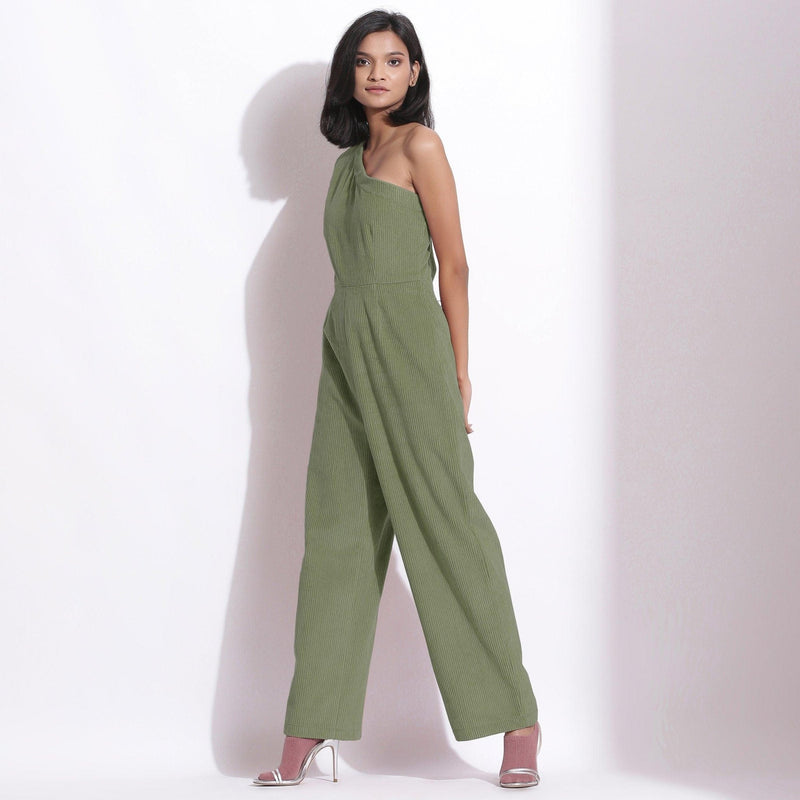 Left View of a Model wearing Sage Green Corduroy One-Shoulder Jumpsuit