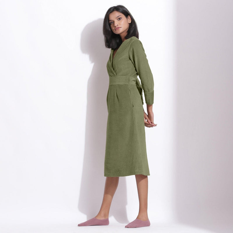 Left View of a Model wearing Cotton Corduroy Sage Green Surplice Dress