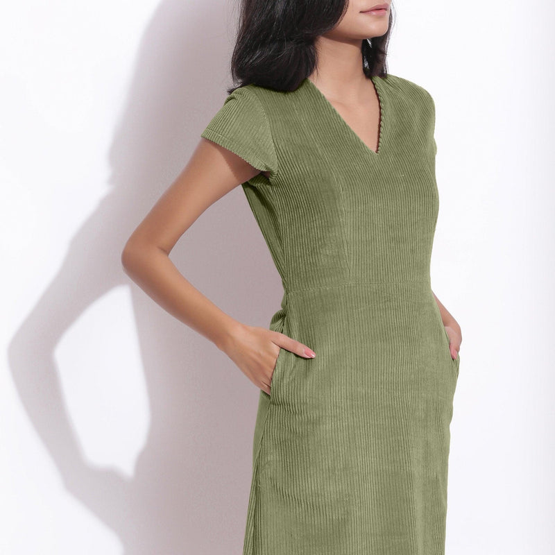 Right View of a Model wearing Sage Green Cotton Corduroy V-Neck Dress