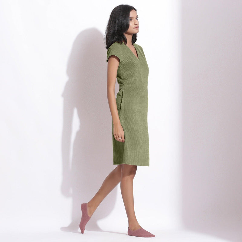 Right View of a Model wearing Sage Green Cotton Corduroy V-Neck Dress