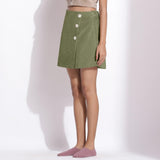 Left View of a Model wearing Sage Green Cotton Corduroy Short Skirt