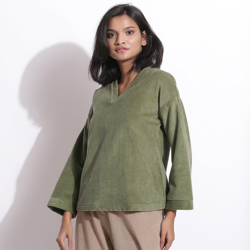 Left View of a Model wearing Sage Green Cotton Corduroy V-Neck Top