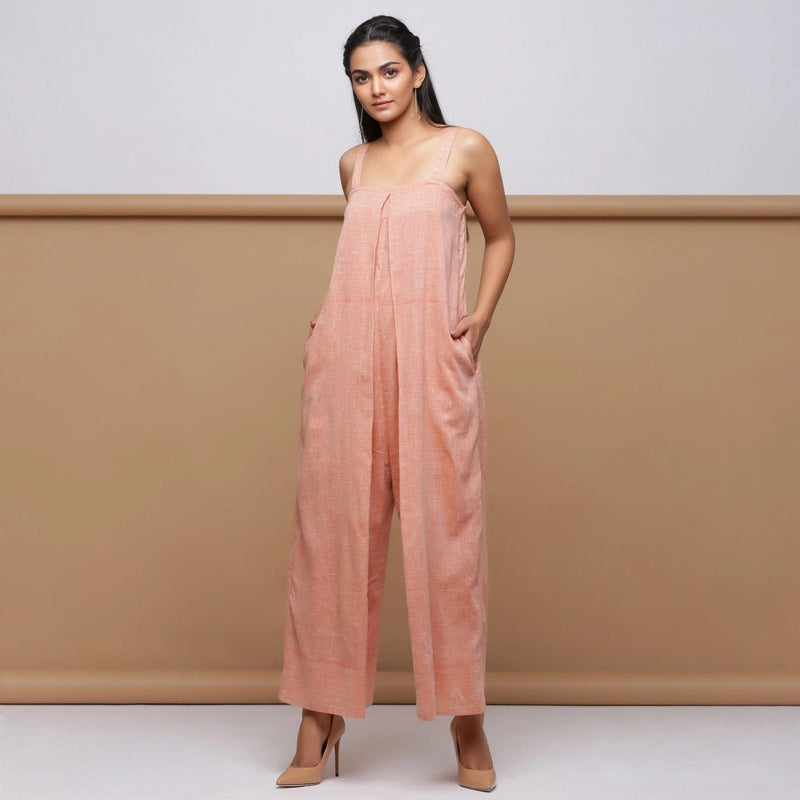 Front View of Model wearing Salmon Pink Handspun Pleated Jumpsuit