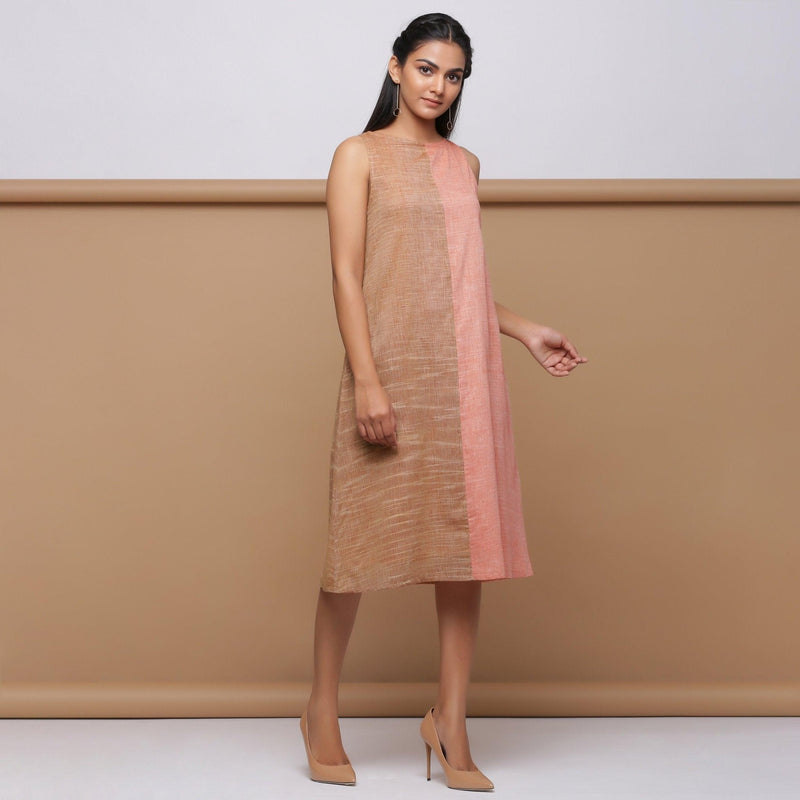 Right View of a Model wearing Salmon Pink Handspun Racer Back A-Line Dress