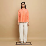 Front View of a Model wearing Salmon Pink Cotton Solid Godet Top