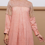 Front Detail of Model wearing Salmon Pink Handspun Pleated Dress