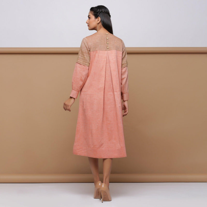 Back View of Model wearing Salmon Pink Handspun Pleated Dress