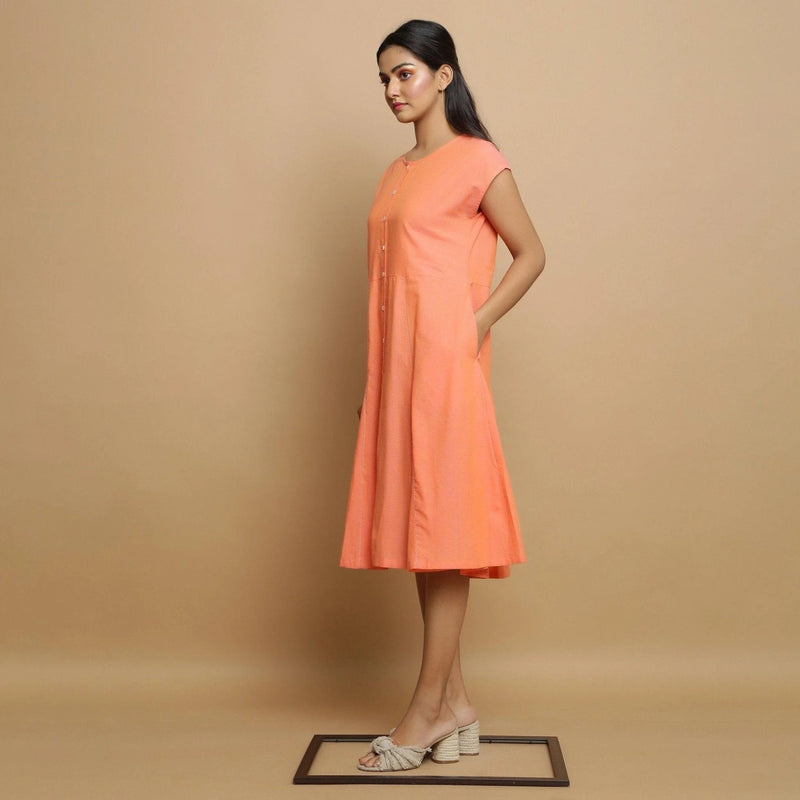 Left View of a Model wearing Salmon Pink Mangalgiri Cotton Button-Down Midi Dress