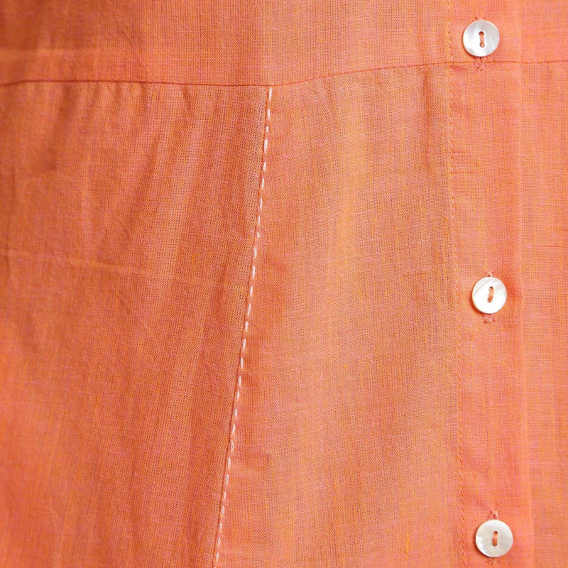 Close View of a Model wearing Salmon Pink Cotton Button-Down Dress