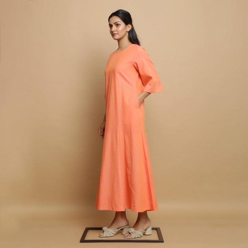 Left View of a Model wearing Salmon Pink Mangalgiri Cotton Flared Dress